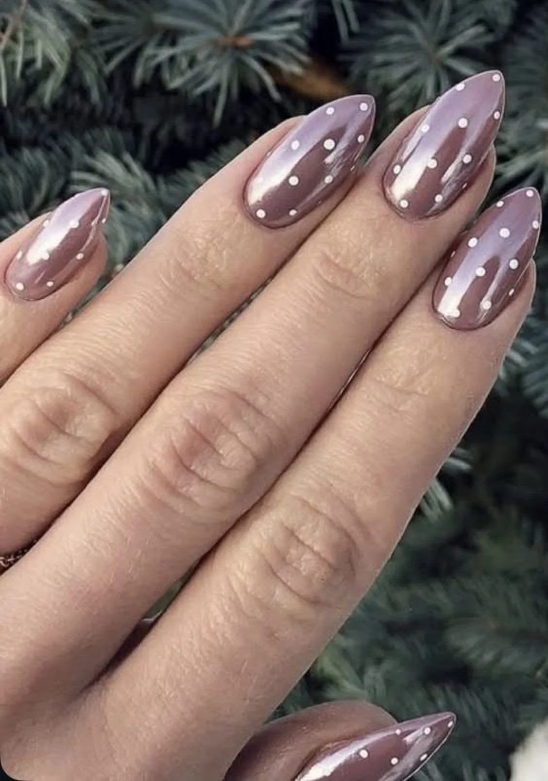 Subtle dot design almond nails with delicate elegant minimalist winter nail art perfect for understated sophisticated manicure 2025