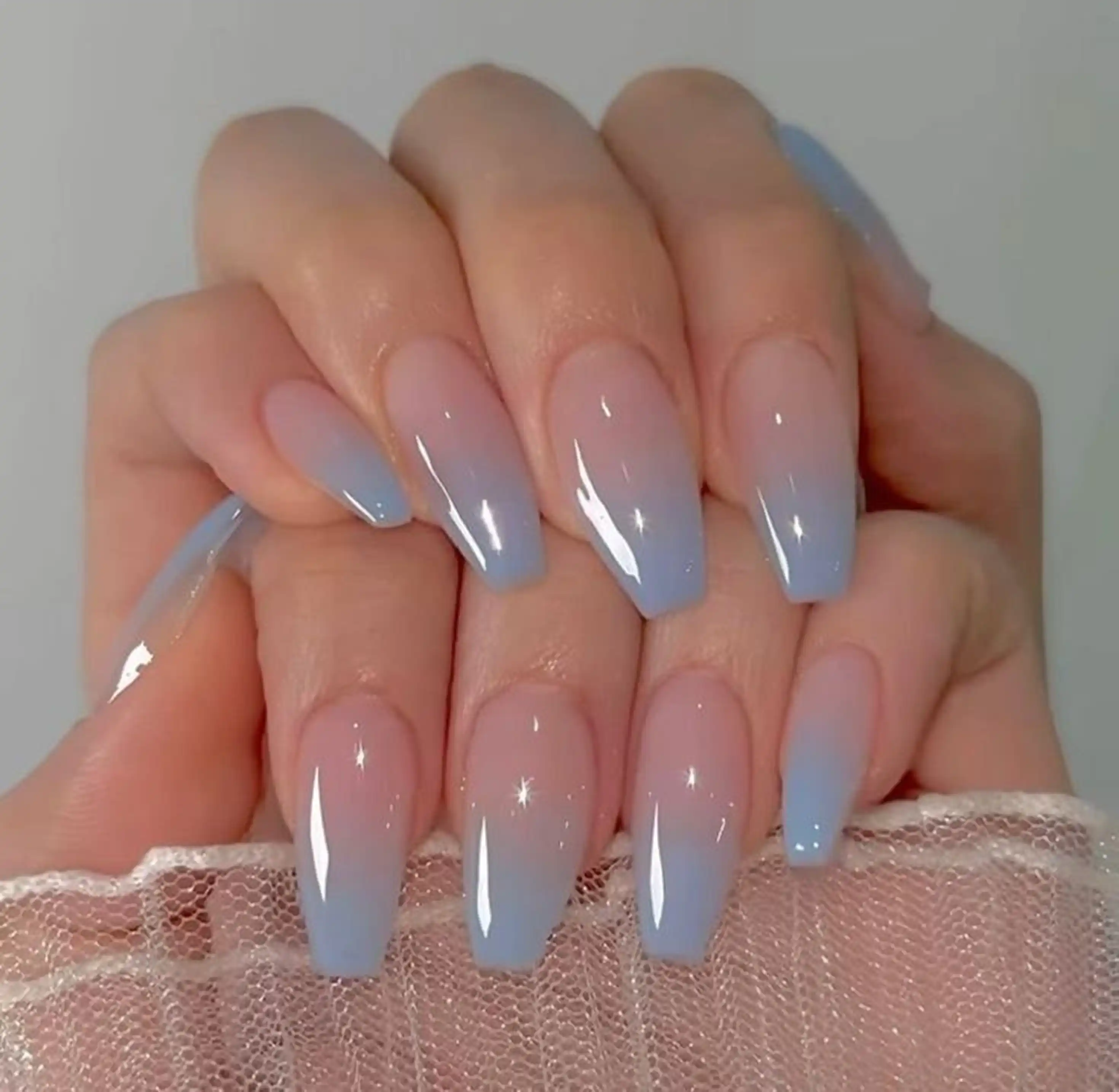 Baby blue white ombre soft pastel gradient spring nails creating feminine delicate manicure sweet