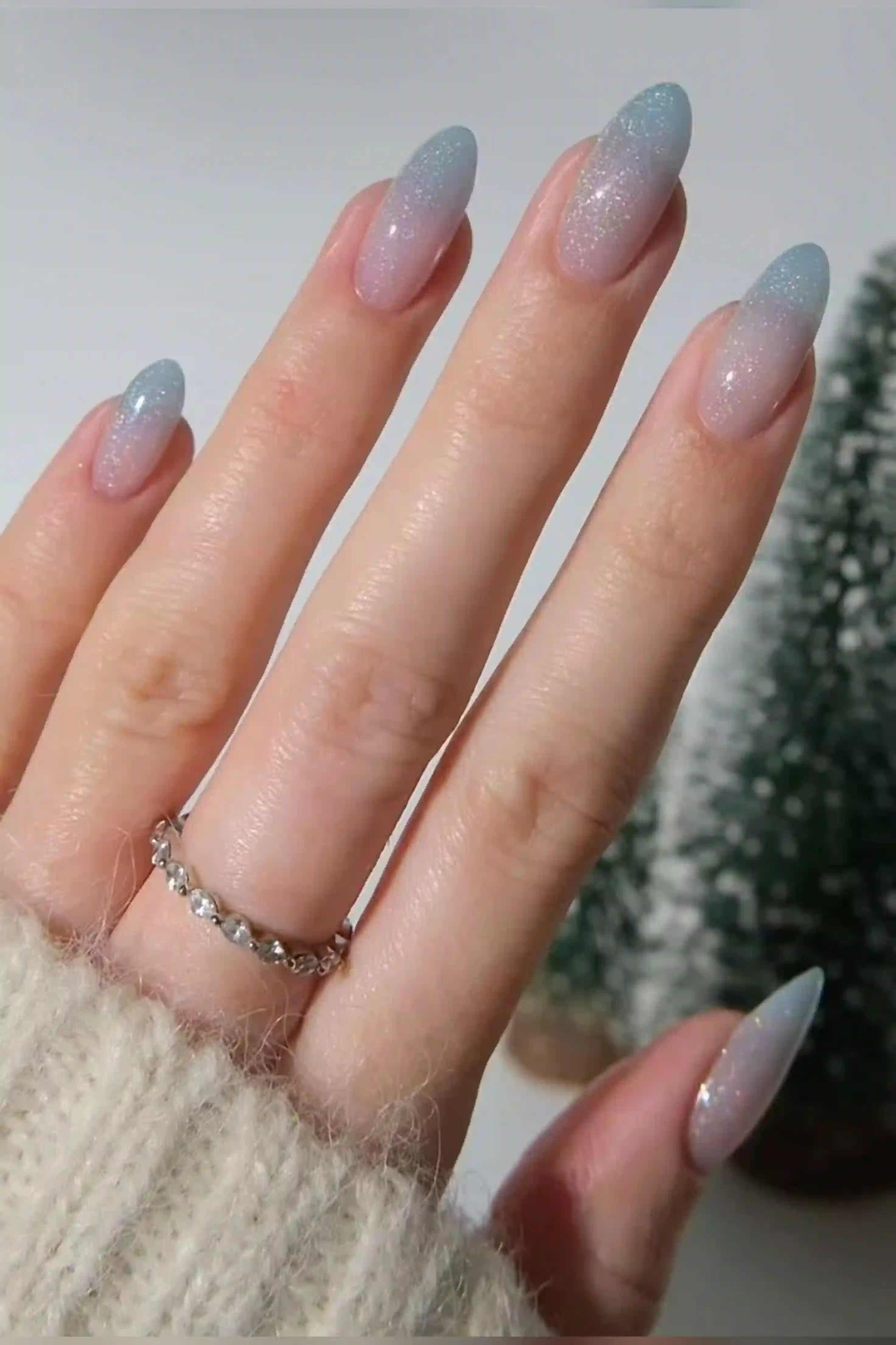 Frosted ombre winter ice gradient cool elegant nails creating sophisticated seasonal manicure holiday