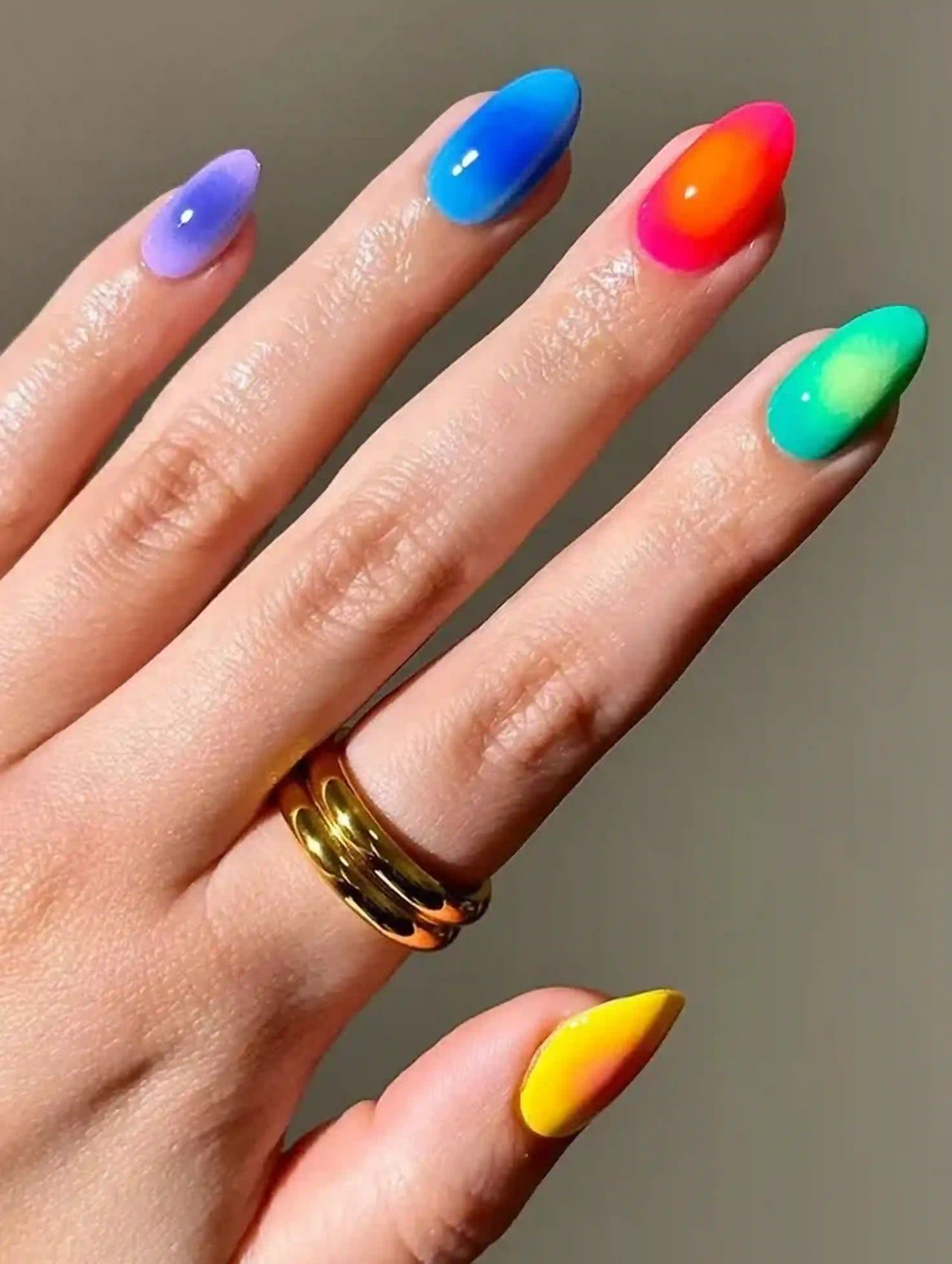 Rainbow ombre colorful vibrant gradient pride nails creating fun playful cheerful manicure festive