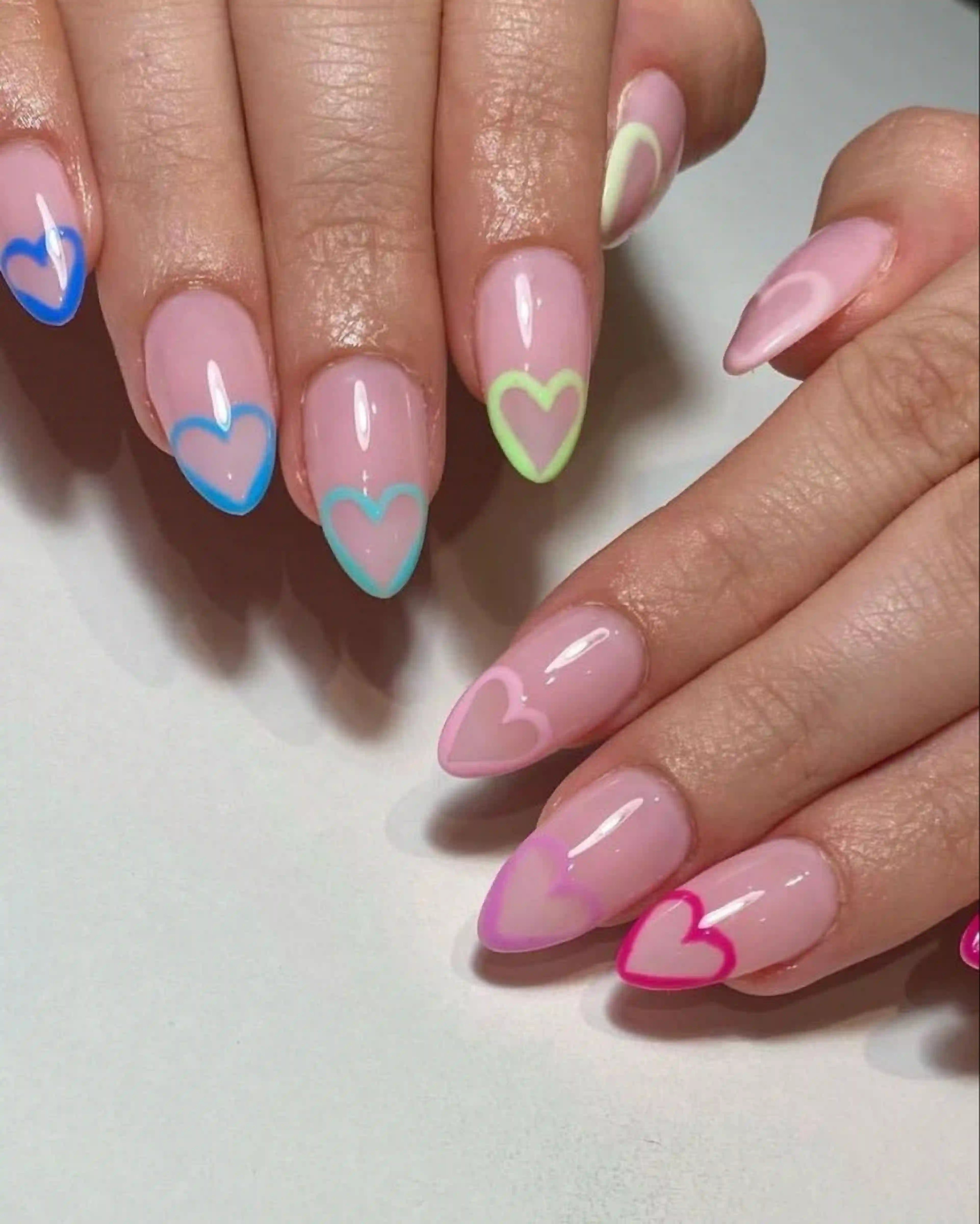 Tie dye hearts colorful playful valentine nails creating fun trendy whimsical cute manicure joy