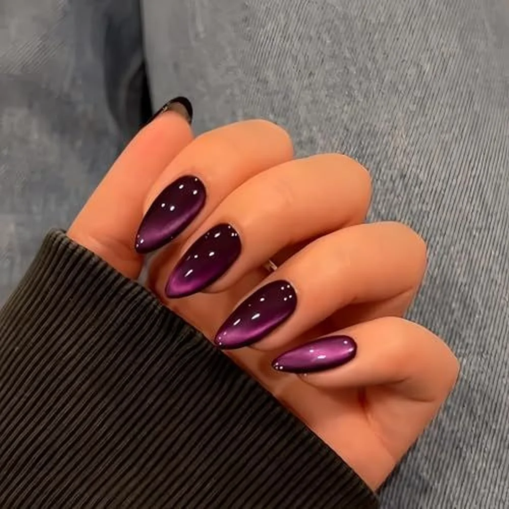 Amethyst purple cat eye nails with magnetic velvet finish creating jewel tone trending winter manicure perfect for festive season