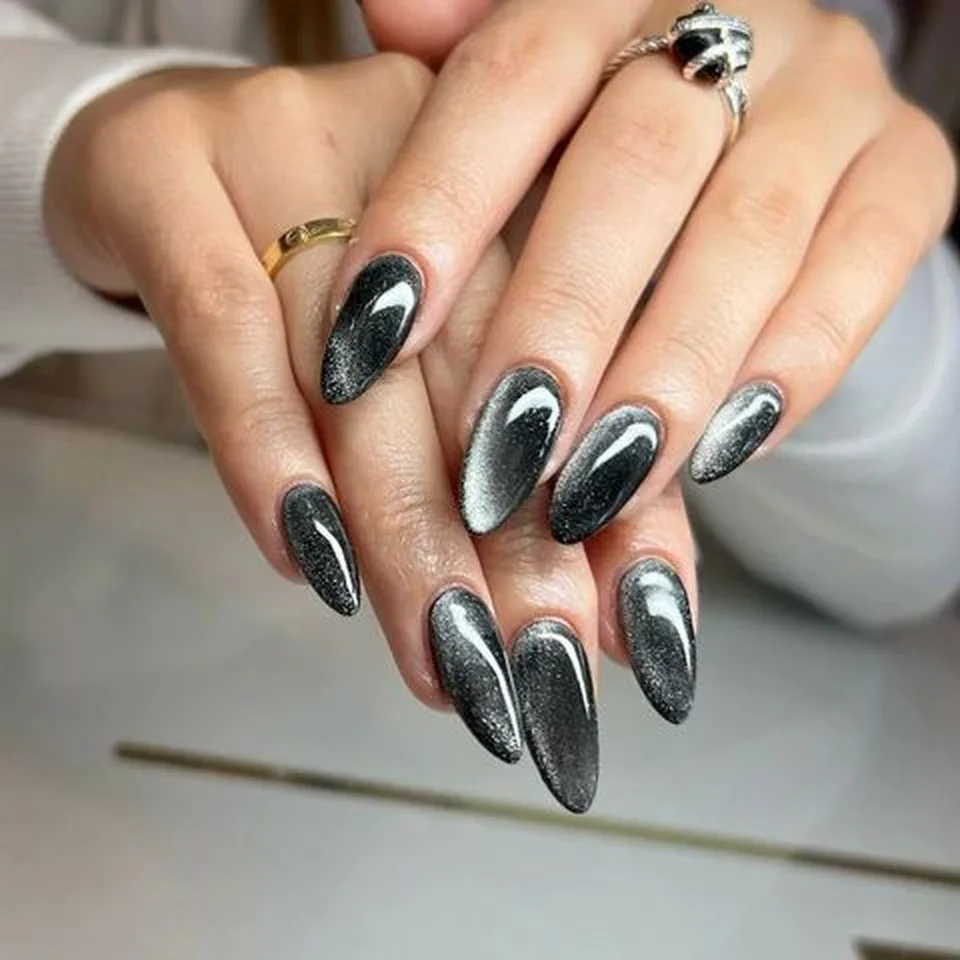 Charcoal gray velvet short nails with cat eye magnetic creating modern chic winter manicure perfect for minimalist edgy style 2025