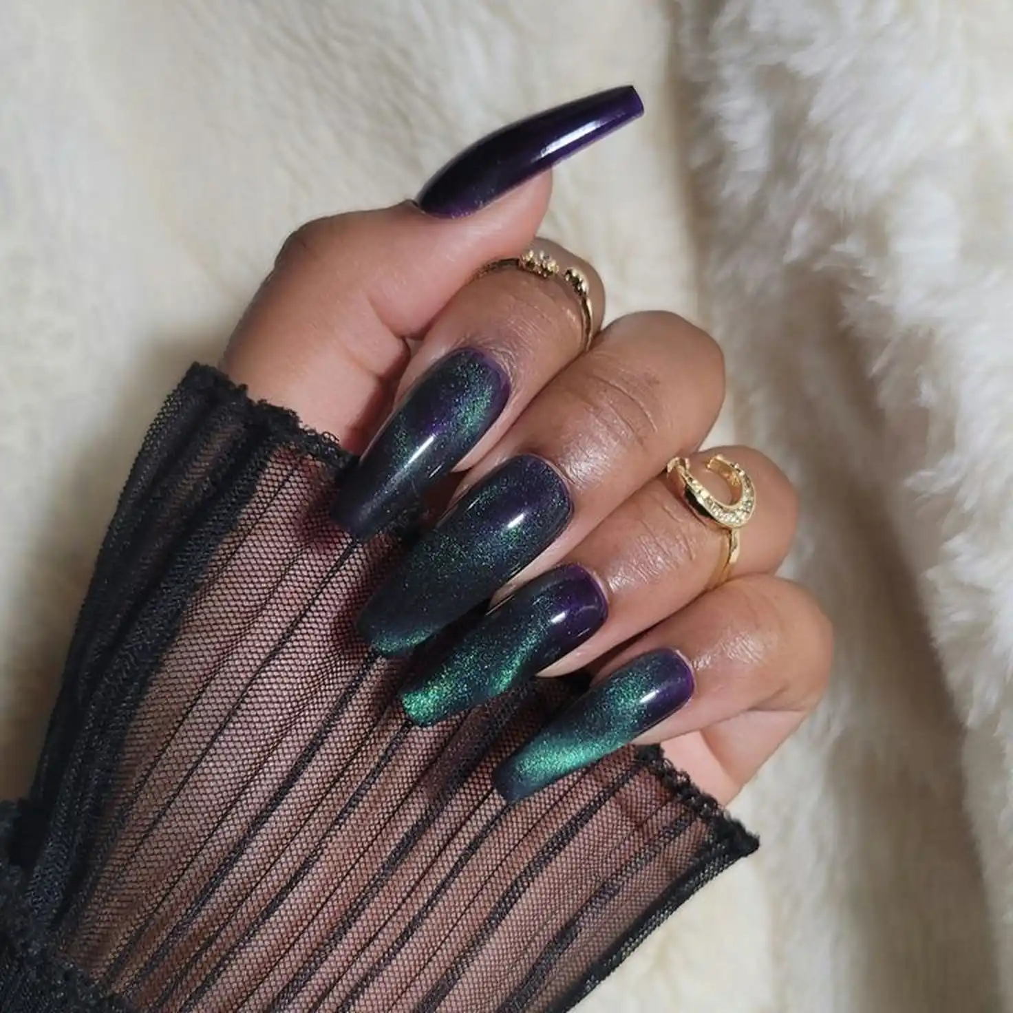 Deep purple magnetic coffin nails with cat eye velvet creating bold statement winter manicure perfect for dramatic fashion look 2025