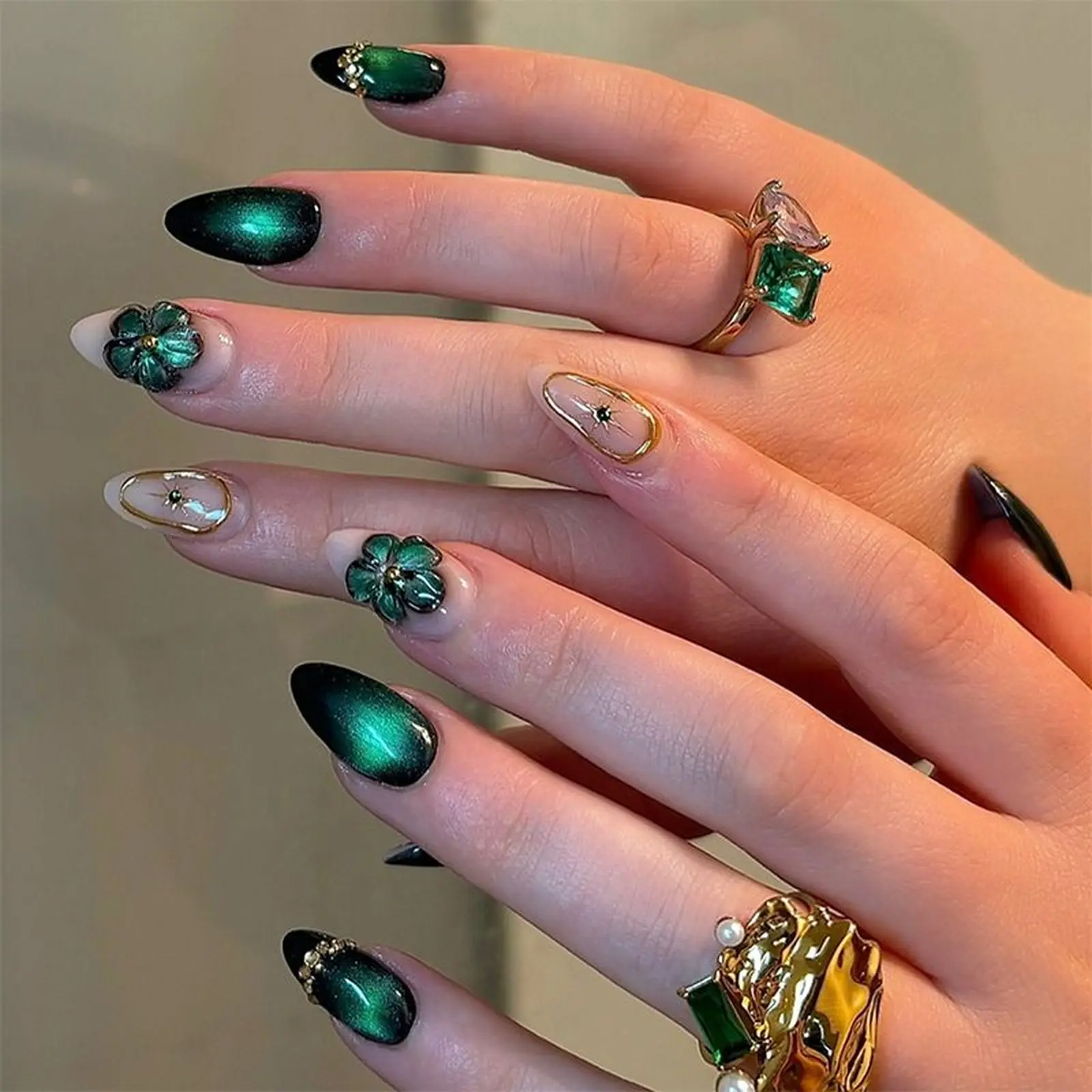Emerald cat eye nails with gold flakes magnetic velvet creating luxury winter party manicure design perfect for holiday glamour 2025