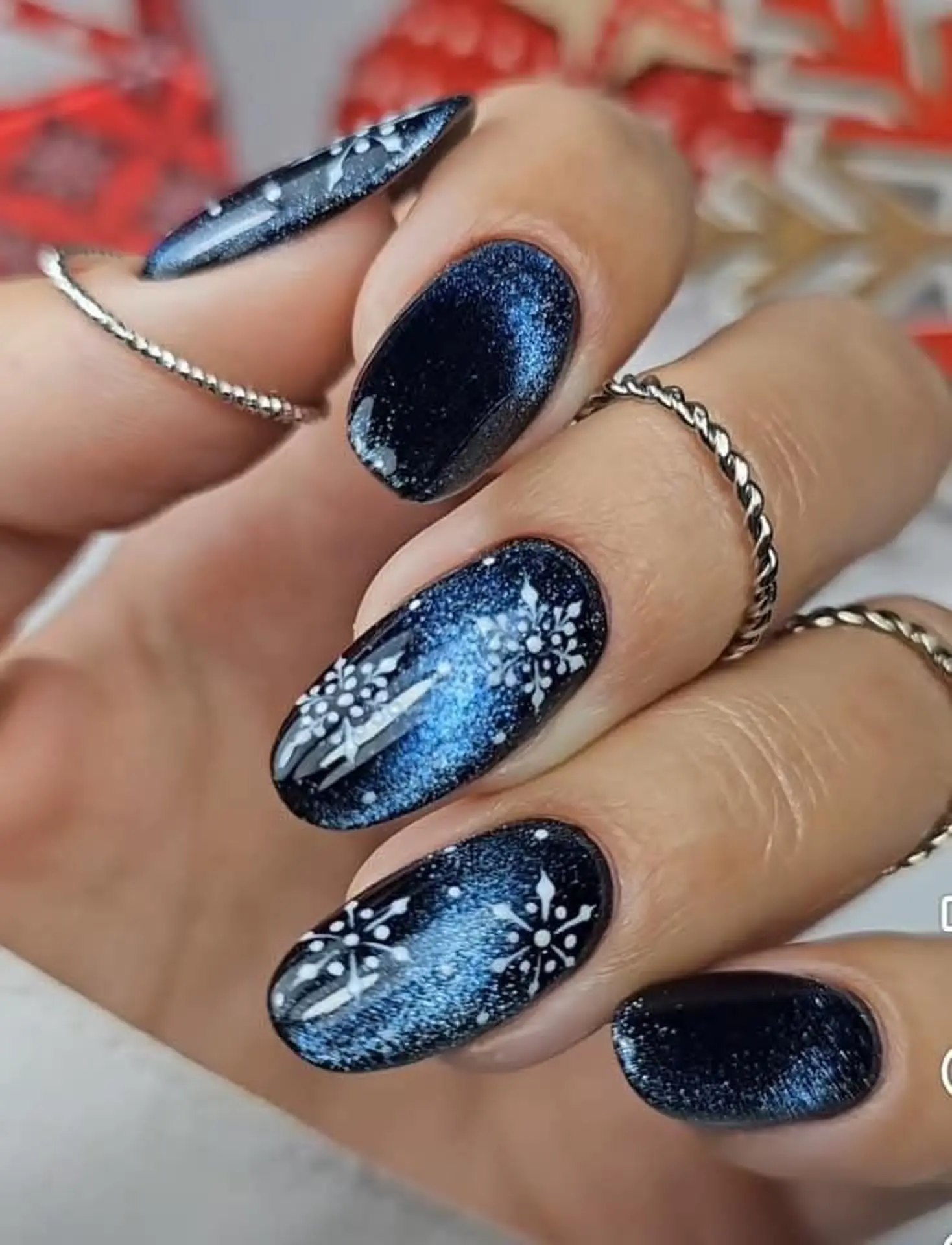 Midnight blue velvet long nails with cat eye magnetic creating dramatic statement winter manicure perfect for bold glamorous events